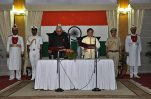 The Governor of Arunachal Pradesh Lt. Gen (Retd) Nirbhay Sharma administering the oath of office and secrecy  to Shri Nabum Tuki as the latter is being sworn-in as the Chief Minister at Darbar Hall, Raj Bhavan on 18th May 2014